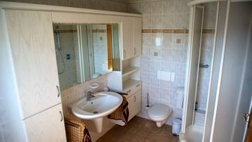 Bathtub, hair dryer, towels, soap
