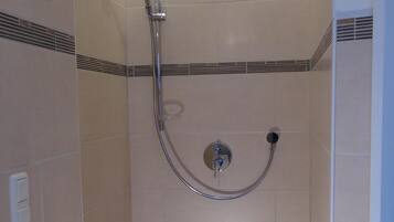 Bathtub, hair dryer, towels, soap