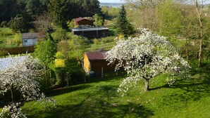 A rural landscape with houses, trees, and a clear sky. - 2 room apartment 36 sqm for 2 guests Swimming pool and sauna approx. 8 minutes walk to the beach WLAN (Zinnowitz)
