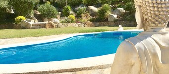 Beautiful house surrounded by an idyllic garden with salt water pool.