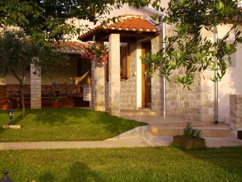 in a village with garden, air condition and barbecue