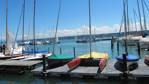A marina with multiple sailboats docked at wooden piers. - Enjoy holidays in a prime location in Konstanz, the holiday in the south right on the shore (Konstanz)