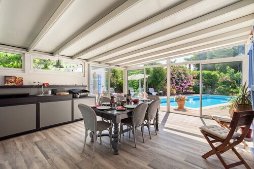 Private sunny villa with large heated pool, air-conditioning and river access.