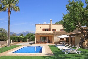 A two-story house with a swimming pool, outdoor seating, and a mountain view. - Finca Marti Ferrer: private swimming pool, garden, barbecue, WiFi, air conditioning. (Inca)