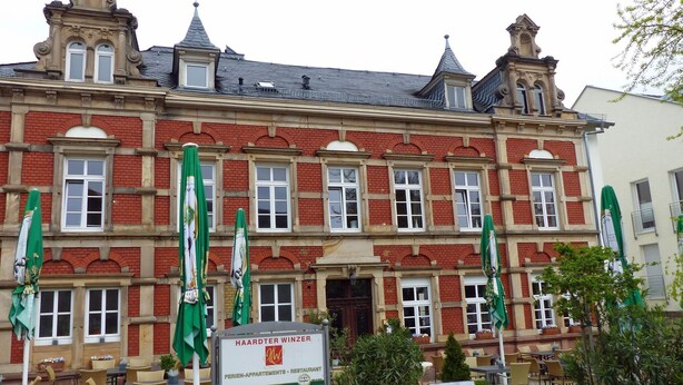 A historic building with a sign for 'Haardter Winzer' indicating it's a restaurant and apartments. - HAARDTER WINZER (Whg. 4) renovated and lovingly decorated "Pfalzcard-Partner" (Neustadt an der Weinstraße)