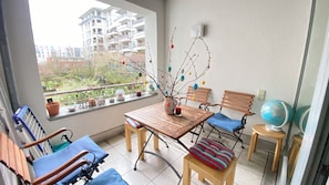 Enjoy a peaceful retreat with a balcony view of the surrounding neighborhood.