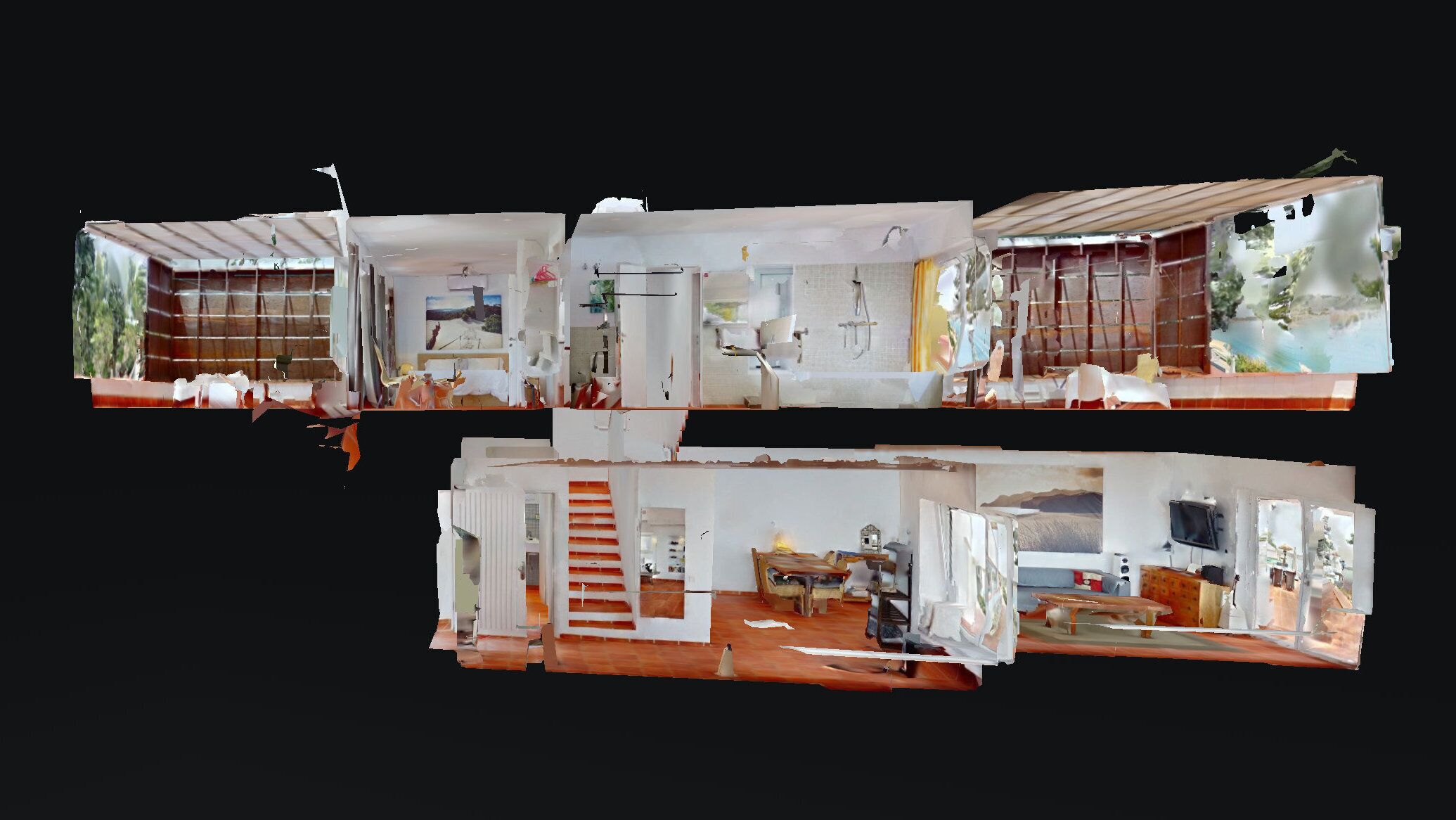 A multi-level interior with a kitchen, dining area, and living room.