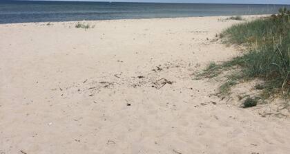 Vacances actives sur la mer Baltique dans le chalet avec cheminée