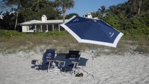 A beach with two blue beach chairs and a large umbrella. - VILLA BELLY :-) heated pool. free WIFI, very private, Garage, BBQ, Kings Lake (Naples)