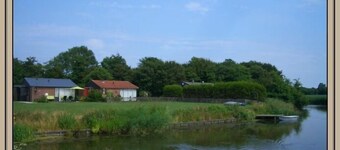 Bungalow + barca a remi + internet - proprio sull'acqua in una posizione tranquilla e perfetta esposta a sud