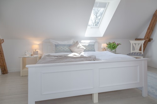 Restored farmhouse on the dyke World Heritage Site Wadden Sea of Schleswig-Holstein