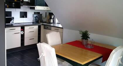 Light and friendly roof apartment with a patio and balcony