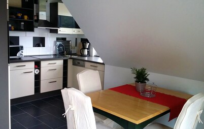 Light and friendly roof apartment with a patio and balcony