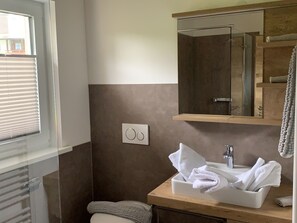 Shower, hair dryer, towels, soap