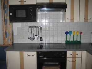 Fridge, microwave, oven, high chair