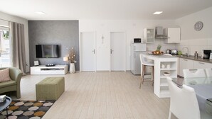 A modern apartment with a living room, dining area, and kitchen. - Beautiful brand new villa ***** with heated swimming pool, summer kitchen, WiFi, grill (Pula)