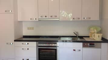 Fridge, stovetop, dishwasher, coffee/tea maker