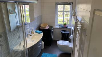Shower, hair dryer, towels, soap