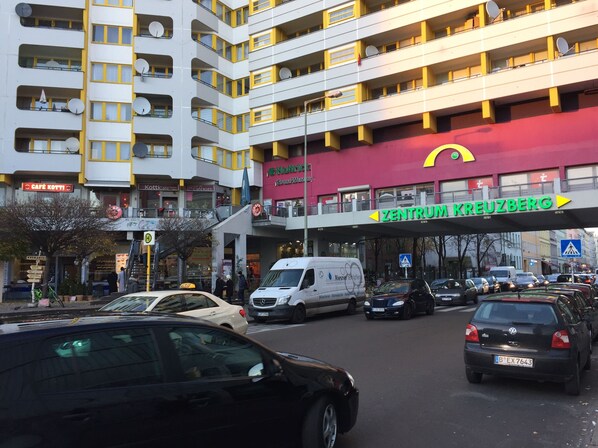 A multi-story building with a prominent red and yellow sign for 'Zentrum Kreuzberg'.
