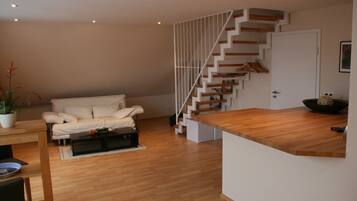 Duplex | Living area | Flat-screen TV