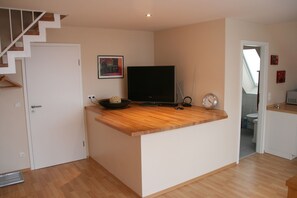 Duplex | Living area | Flat-screen TV