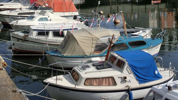 A marina with boats docked, a bridge, and buildings in the background. - Comfortable 4-star roof terrace apartment, quiet and central, 4 adults + 1 baby (Rostock)