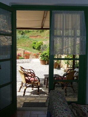 Step into a serene garden oasis with a charming outdoor seating area.