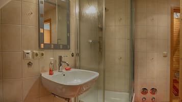 Shower, towels, soap, toilet paper