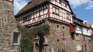 A traditional half-timbered building with stone walls and a tiled roof. - Holiday house for 6 - 7 persons (Rothenberg)