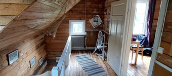 House on Hummel Bay in front of the archipelago and Skuleskogen National Park, High Coast
