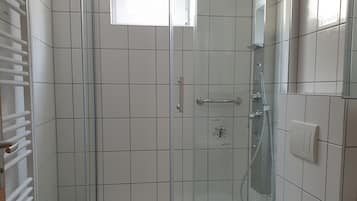 Shower, towels, soap, toilet paper