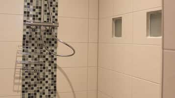 Bathtub, hair dryer, towels, soap