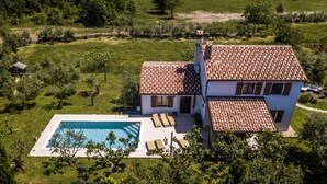 A two-story house with a tiled roof, a swimming pool, and a garden. - Summer offer/ Villa ULIKA, near the sea/with private pool/quiet place (Rakalj)