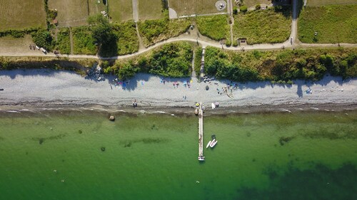 On the wildly romantic natural beach, enchanting view, cozy with stove, sauna