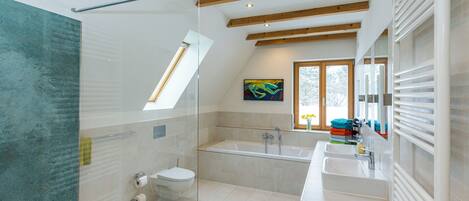 Bathtub, hair dryer, towels, soap