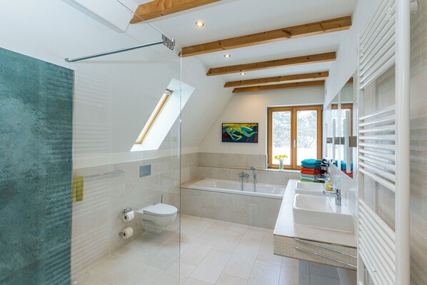 Bathtub, hair dryer, towels, soap
