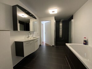 Bathtub, hair dryer, towels, soap