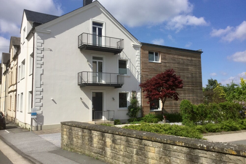 Living in a renovated 1907 town house with garden and pool