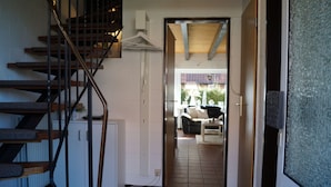 A staircase leading to a room with a view of the outside.