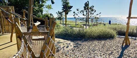 On the beach, sun-loungers
