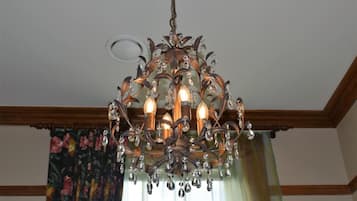 A chandelier with multiple lights and crystal decorations.