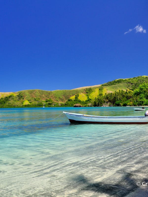 On the beach, white sand, sun loungers, beach towels