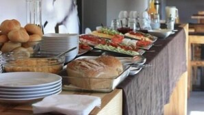 A buffet setup with various food items, including bread, salads, and a beverage station. - Barcelona Rooms&Restaurant (Stegna)