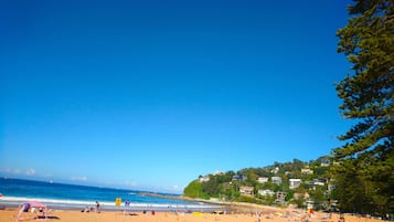 Beach nearby, white sand, beach towels, 3 beach bars