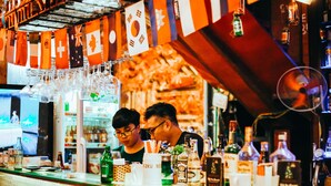 A bar with a variety of bottles and glasses on the counter. - TravelBox Dorm Sweet Dorm - Hostel (Hanoi)