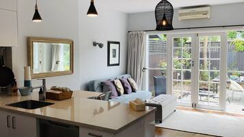 Family Townhome, 2 Bedrooms | Living area | Flat-screen TV