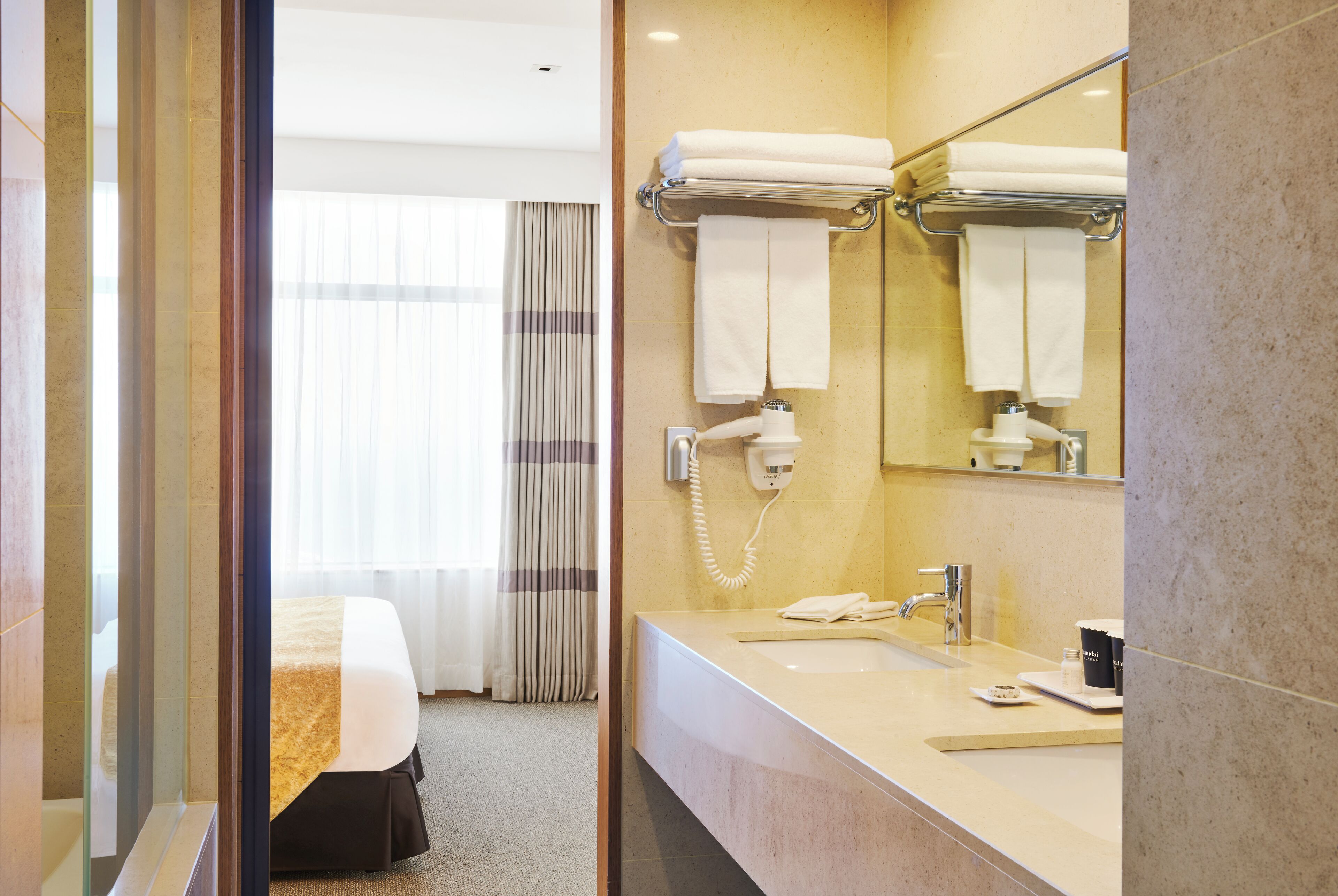 corner suite, ocean view | bathroom | shower, hair dryer, bathrobes, slippers