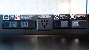 A power outlet with multiple sockets, a universal outlet, and a refrigerator switch.