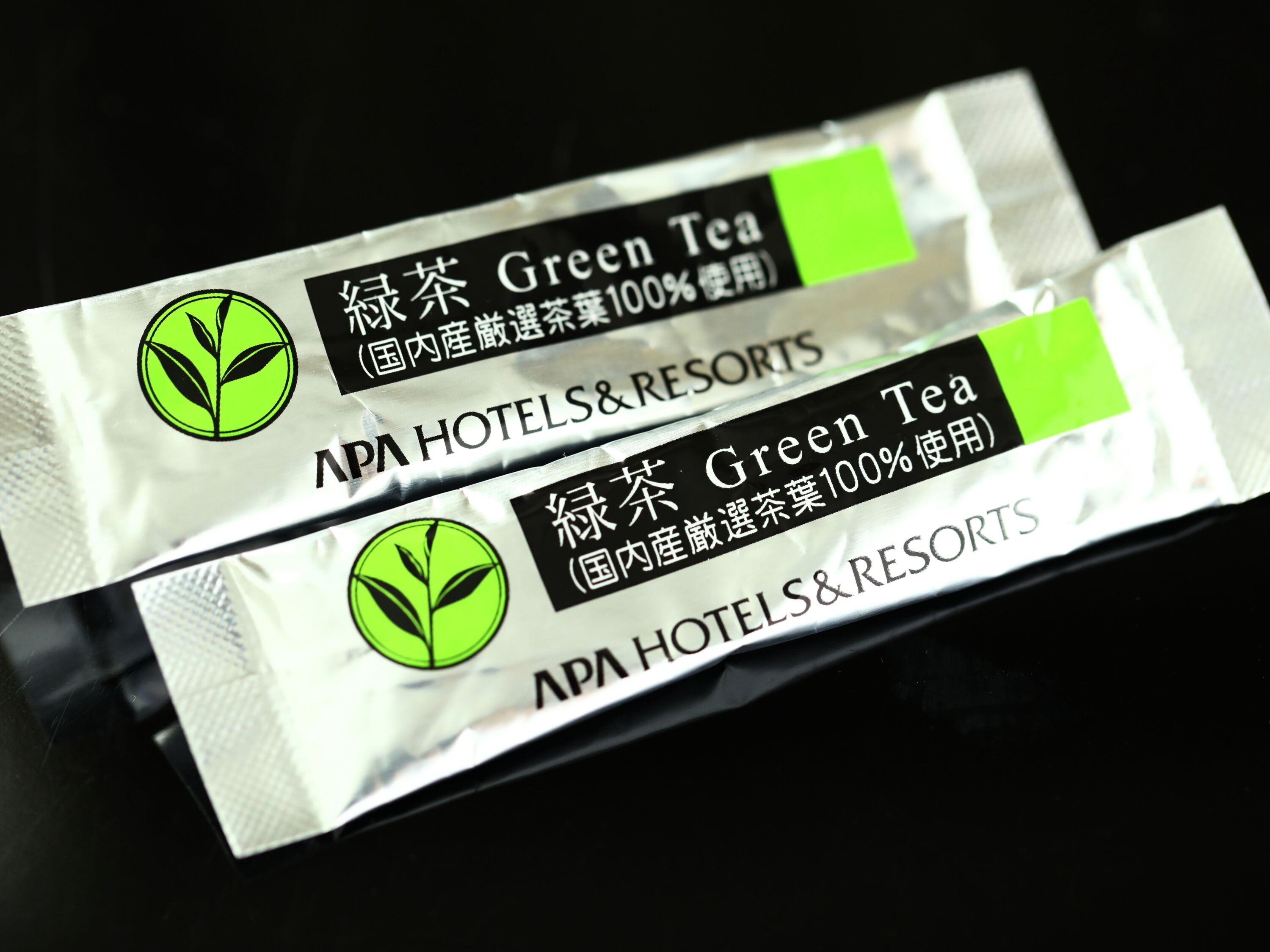 Two packages of green tea from APA Hotels & Resorts.