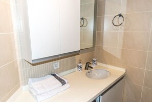 Apartment, 1 Bedroom | Bathroom | Shower, free toiletries, hair dryer, towels - Dumankaya Ikon 40 Floor 1 Bedroom B (Istanbul)